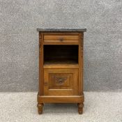 An early 20th century French Art Deco walnut bedside cabinet having a grey marble top above a single