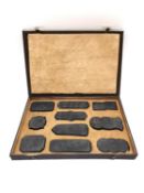 A Chinese calligraphy stone ink block set circa 1900, intricately carved in relief and hand