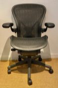 A contemporary Herman Miller 'Aeron' adjustable ergonomic office desk chair with maker's labels. H.