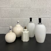 A collection of ceramic table lamps to include a pair of baluster vase form, two globular, and one