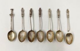 A set of six C.1900 hallmarked silver scalloped teaspoons with apostle figure finials on twisted