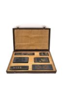 A Chinese calligraphy stone ink block set circa 1900, intricately carved in relief and hand