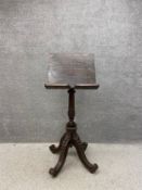 A late 19th century stained oak ecclesiastical lecturn or music stand having a wedge shaped book/