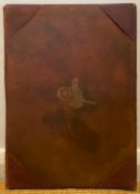 A collection of hand painted calligraphic firmans with a leather bound cover, possibly 18th or