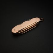 WITHDRAWN - See Lot 1 for a full explanation. A hallmarked 9ct rose gold pocket knife with two