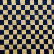 A contemporary woollen Afghan Choobi carpet having an all-over chequered pattern in midnight blue