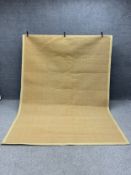 A large sisal carpet with a complementary khaki canvas border. L.288 W.200cm
