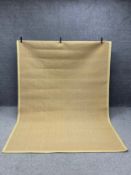 A large sisal carpet with a complementary khaki canvas border. L.288 W.200cm
