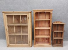Three bookshelves to include a small C.1900 Arts and Crafts style open bookshelf having a shaped