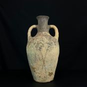 A large Roman style terracotta twin handled olive jar or amphora hand painted with geometric