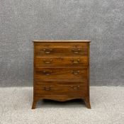 A Georgian mahogany bachelor's chest of drawers of small size having a rectangular thumb moulded top