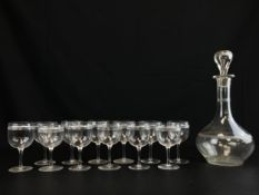 An etched glass decanter or carafe of globular form with narrow neck with stopper along with a set
