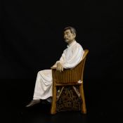 A late 20th century Chinese figure depicting the revolutionary writer and critic Lu Xun seated