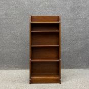 A small 20h century oak waterfall bookshelf. H.101.5 W.46 D.18.5cm