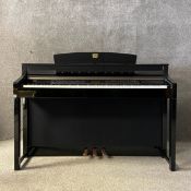 A contemporary Yamaha Clavinova digital upright piano model CLP-380PE. H.92 W.140.5 D.51cm