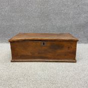 A small 18th century elm chest with a hinged lid raised on a moulded plinth base. H.30 W.80 D.44cm