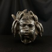 A late 19th century cast spelter architectural mask mount possibly from a fountain depicting the