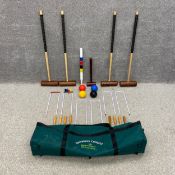 A croquet set by Townsend Croquet complete with mallets and balls etc for four players with a bag.