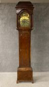 A George III burr walnut and crossbanded longcase clock having a stepped caddy topped cornice over
