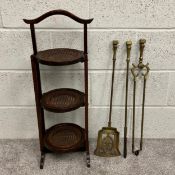 A set of three 19th century brass fireside utensils. H.65cm together with an Edwardian mahogany