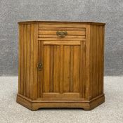 A 19th century walnut floor standing corner cabinet having a single frieze drawer above a panelled