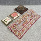 A wall hanging tapestry with all-over floral designs along with three needlework cushions. L.173 W.