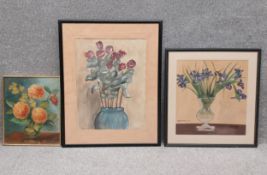 A collection of three paintings to include an early 20th century oil on board, still life flowers in