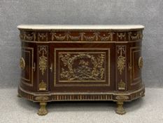 A contemporary Louis XVI style mahogany credenza with profuse all-over ormolu mounts having a shaped