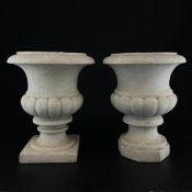 A near pair of 19th century Neoclassical style white marble campana form urns each having a wide