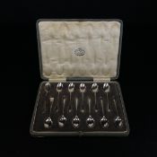 A matched set of twelve hallmarked silver tea spoons in a fitted baize lined case to include ten