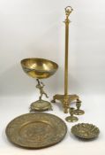 A collection of brass to include a tazza centre piece with a putto or cherub holding aloft a large
