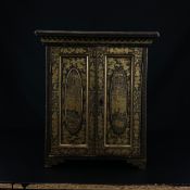 A 19th century Chinese export lacquered and gilt jewellery cabinet having a moulded cornice above