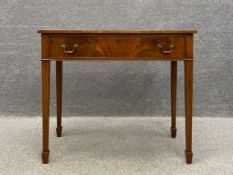 A Georgian style mahogany side table with a single bow fronted and cockbeaded frieze drawer raised