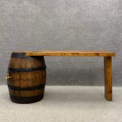 A 20th century scratch built bar or table having a heavy five plank pine top supported on one end by