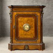 A 19th century style burr walnut pier cabinet having a shaped black marble top with a moulded edge
