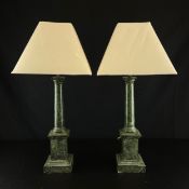A pair of early 20th century Art Deco simulated marble table lamps of Neoclassical column form