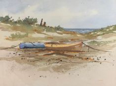 A 20th century watercolour depicting two beached boats on a coastal landscape, signed S. Madden to