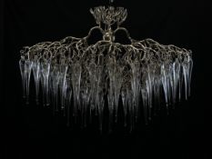 A contemporary 'Hollywood Glass' chandelier having a naturalistic polished nickel tree branch