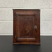 A small 17th century marquetry inlaid oak cabinet with key. H.37 W.30 D.21.5cm