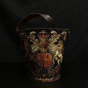 A George III leather and studwork fire bucket with a leather strap handle C.1780 intricately hand