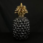 An early to mid 20th century Art Deco style ceramic lamp in the form of a gloss black pineapple with
