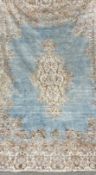 A large handmade Persian style Kerman carpet having a central quatrefoil medallion lozenge over a