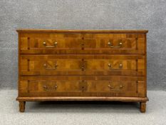 An 18th century Italian parquetry and crossbanded fruitwood commode having a rectangular moulded top