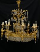 A 20th century Neoclassical style chandelier having a stacked globular cut glass stem within a