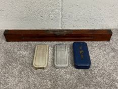 A collection of three early 20th century Rolls Razors along with an early 20th century brass mounted