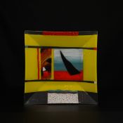 A large mid century art glass platter of square form with De Stijl style abstract designs by Simon
