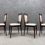 A set of four 20th century Danish style dining chairs each having a shaped and slightly flared