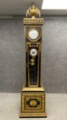 A 20th century French empire style quarter chiming longcase clock by Romanet Morbier France having a
