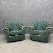 A pair of mid 20th century Art Deco style armchairs each having a curved and scalloped shell or