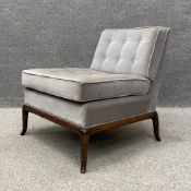A 20th century 'Slipper' style chair having a square cushioned button back and seat upholstered in